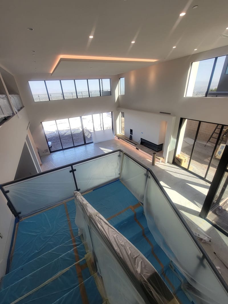 Two-story modern home interior with freshly painted white walls