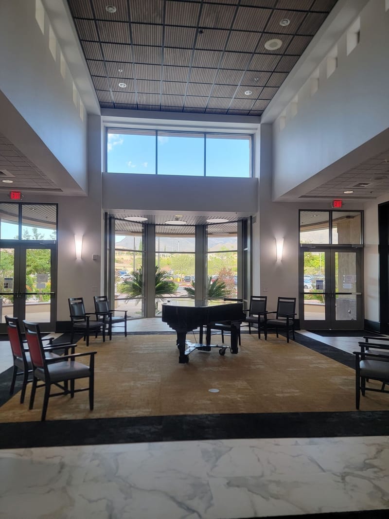 Commercial lobby with grand piano and freshly painted walls