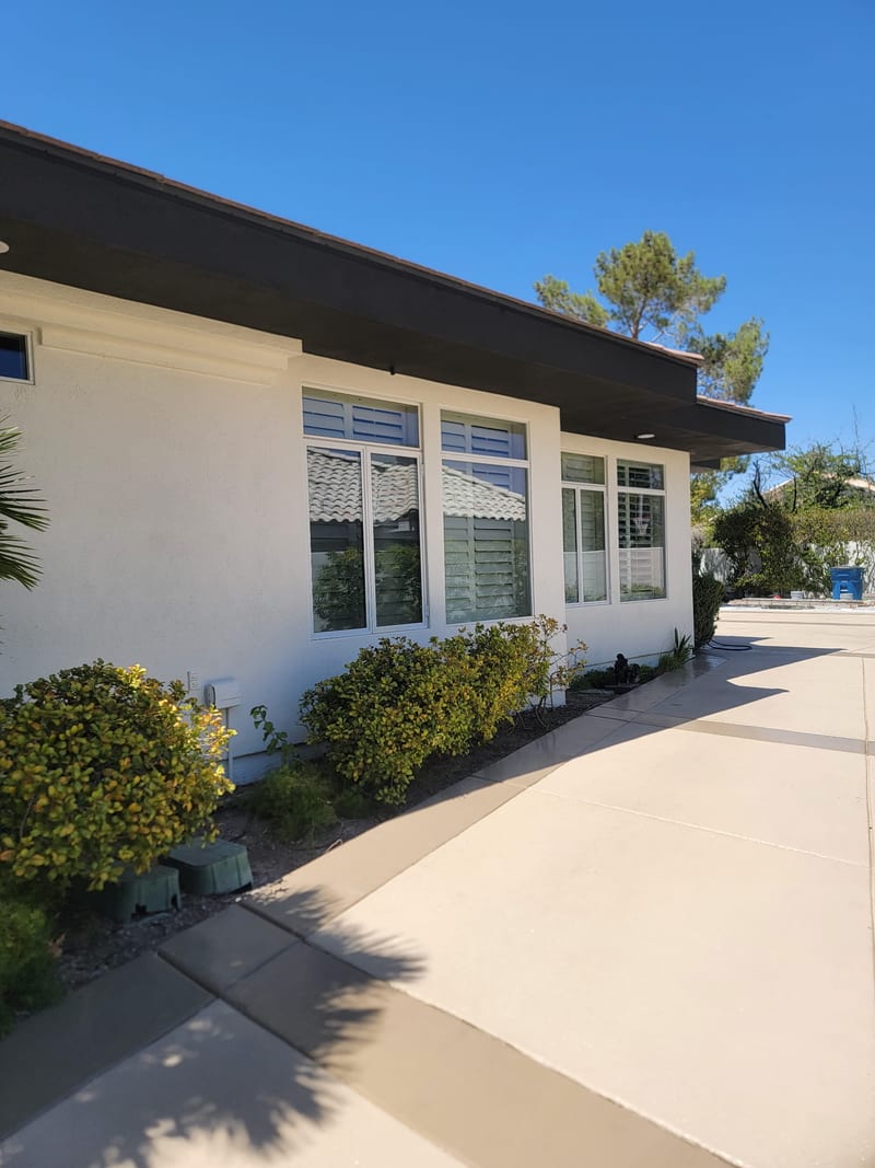 Exterior repaint by Mark Anthony Painting — white stucco home with trim, Las Vegas NV